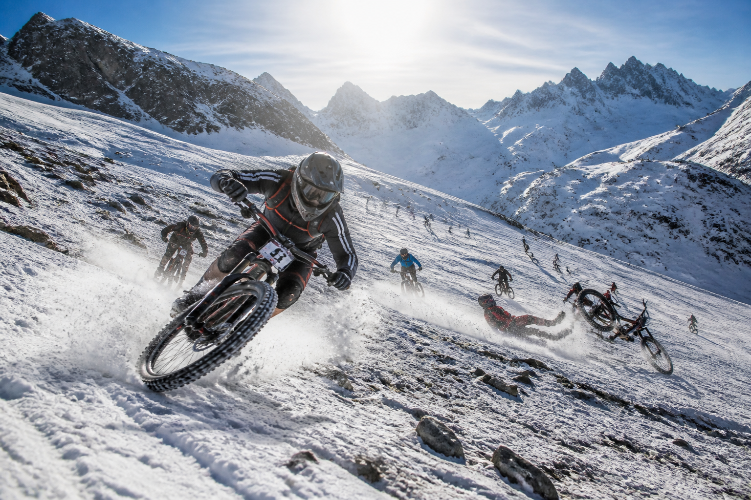 Glacier start concept &mdash; riders descending the snowfield below Blackcomb